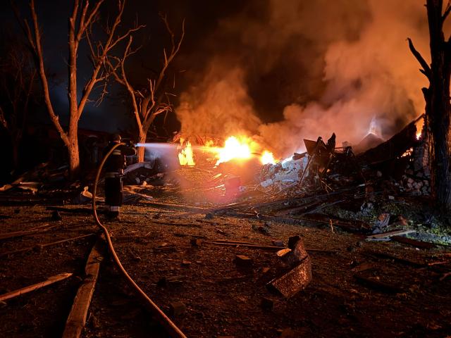An Ukrainian rescuer works at the site of a Russian strike in Zaporizhzhia on August 11, 2026, amid the Russian invasion of Ukraine. (Photo by Darya NAZAROVA / AFP)