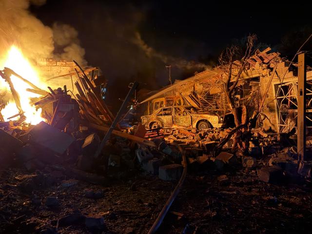 TOPSHOT - An Ukrainian rescuer works at the site of a Russian strike in Zaporizhzhia on August 11, 2026, amid the Russian invasion of Ukraine. (Photo by Darya NAZAROVA / AFP)