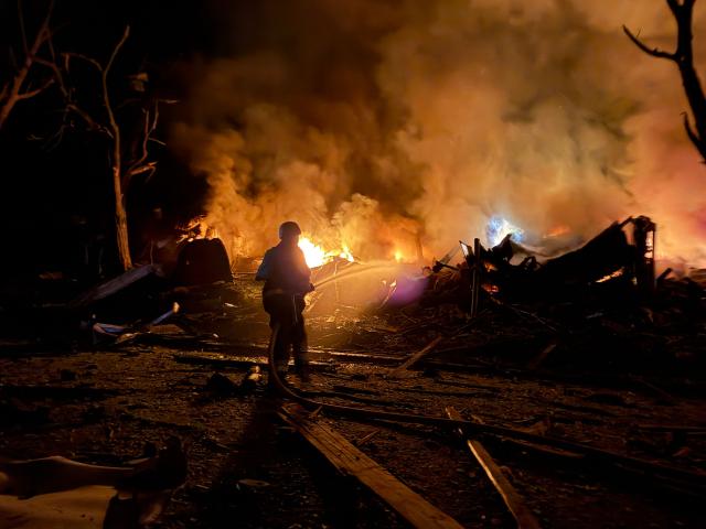 An Ukrainian rescuer works at the site of a Russian strike in Zaporizhzhia on August 11, 2026, amid the Russian invasion of Ukraine. (Photo by Darya NAZAROVA / AFP)