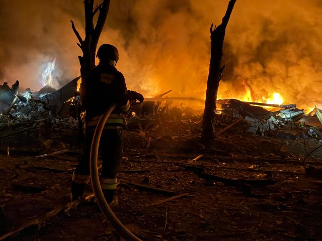 An Ukrainian rescuer works at the site of a Russian strike in Zaporizhzhia on August 11, 2026, amid the Russian invasion of Ukraine. (Photo by Darya NAZAROVA / AFP)