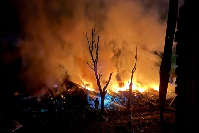 TOPSHOT - An Ukrainian rescuer works at the site of a Russian strike in Zaporizhzhia on August 11, 2026, amid the Russian invasion of Ukraine. (Photo by Darya NAZAROVA / AFP)