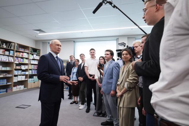In this pool photograph distributed by the Russian state agency Sputnik, Russia's President Vladimir Putin meets with students, postgraduates and young scientists of the Novosibirsk region in Novosibirsk on August 11, 2026. (Photo by Gavriil Grigorov / POOL / AFP)