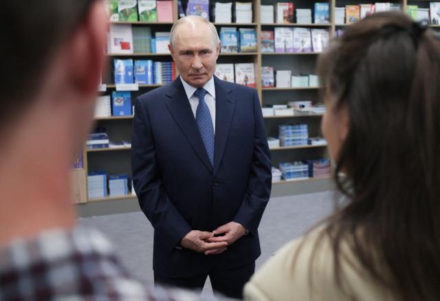 In this pool photograph distributed by the Russian state agency Sputnik, Russia's President Vladimir Putin meets with students, postgraduates and young scientists of the Novosibirsk region in Novosibirsk on August 11, 2026. (Photo by Gavriil Grigorov / POOL / AFP)
