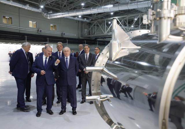 In this pool photograph distributed by the Russian state agency Sputnik, Russia's President Vladimir Putin visits the Siberian Circular Photon Source synchrotron radiation facility outside Novosibirsk on August 11, 2026. (Photo by Gavriil Grigorov / POOL / AFP)