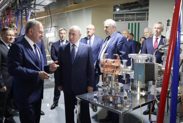 In this pool photograph distributed by the Russian state agency Sputnik, Russia's President Vladimir Putin visits the Siberian Circular Photon Source synchrotron radiation facility outside Novosibirsk on August 11, 2026. (Photo by Gavriil Grigorov / POOL / AFP)