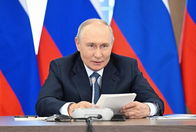 In this pool photograph distributed by the Russian state agency Sputnik, Russia's President Vladimir Putin chairs a meeting of the Council for Science and Education in the Novosibirsk region on August 11, 2026. (Photo by Kristina Solovyova / POOL / AFP)