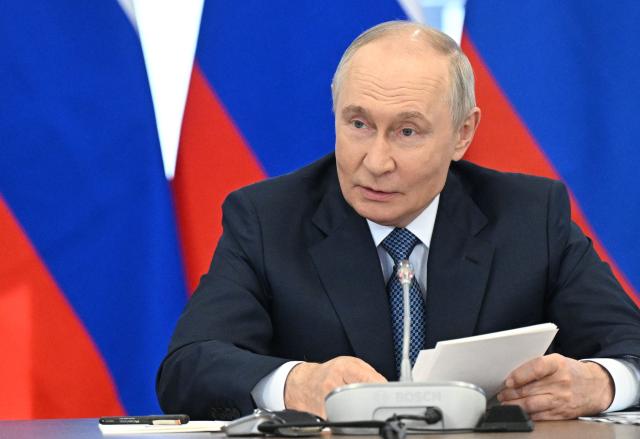 In this pool photograph distributed by the Russian state agency Sputnik, Russia's President Vladimir Putin chairs a meeting of the Council for Science and Education in the Novosibirsk region on August 11, 2026. (Photo by Kristina Solovyova / POOL / AFP)