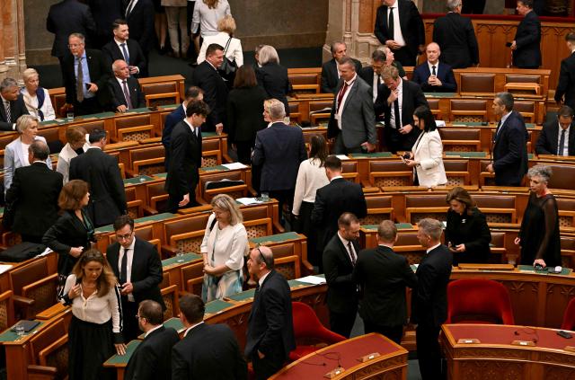 Members of the Hungarian Parliament leave the plenary hall to participate in a secret ballot to elect a new president at the parliament in Budapest on August 11, 2026. Hungarian lawmakers are expected to elect former supreme court chief Andras Baka, who was fired under ex-premier Viktor Orban, as the country's next head of state. The post became vacant following the contested removal of the previous president Tamas Sulyok, an Orban ally, as pro-EU conservative Prime Minister Peter Magyar pushes to loosen his predecessor's lingering hold over state institutions. Magyar's ruling Tisza party nominated Baka -- who served 17 years as a judge on the European Court of Human Rights (ECHR) -- for the largely ceremonial role. Magyar's party won April 2026 elections, ending nationalist Orban's 16 years in power and promising "system change". (Photo by Attila KISBENEDEK / AFP)