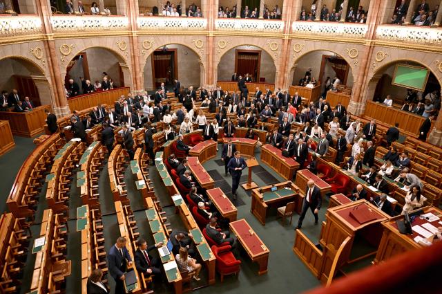 Members of the Hungarian Parliament leave the plenary hall to participate in a secret ballot to elect a new president at the parliament in Budapest on August 11, 2026. Hungarian lawmakers are expected to elect former supreme court chief Andras Baka, who was fired under ex-premier Viktor Orban, as the country's next head of state. The post became vacant following the contested removal of the previous president Tamas Sulyok, an Orban ally, as pro-EU conservative Prime Minister Peter Magyar pushes to loosen his predecessor's lingering hold over state institutions. Magyar's ruling Tisza party nominated Baka -- who served 17 years as a judge on the European Court of Human Rights (ECHR) -- for the largely ceremonial role. Magyar's party won April 2026 elections, ending nationalist Orban's 16 years in power and promising "system change". (Photo by Attila KISBENEDEK / AFP)