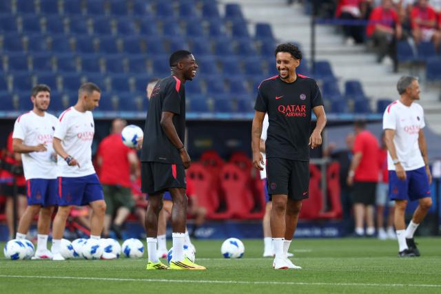 Paris Saint-Germain's Brazilian defender #05 Marquinhos (R) and Paris Saint-Germain's French forward #10 Ousmane Dembele share a joke a training session on August 11, 2026, the eve of the UEFA Supercup football match between Champions League winners Paris Saint Germain (PSG) and Europa League winners Aston Villa in Salzburg, Austria. (Photo by FRANCK FIFE / AFP)