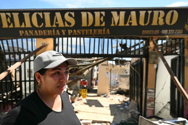 Store manager of "Delicias de Mauro", Juliana Amaya, speaks during an interview with AFP following an earthquake in Pereira, Colombia on August 11, 2026. Colombian volunteers and rescuers cleared rubble with their bare hands to search for survivors early on August 11 after the country's strongest earthquake in a decade killed at least 169 people and smashed dozens of buildings. (Photo by Luis ACOSTA / AFP)