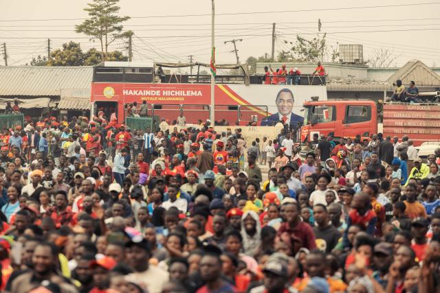 Supporters of Zambian incumbent President and United Party for National Development (UPND) presidential candidate Hakainde Hichilema gather as they attend an election campaign rally in Lusaka on August 11, 2026. Tens of thousands of supporters of Zambian President Hakainde Hichilema thronged the capital Lusaka Tuesday as he made a last-ditch effort to sway undecided voters two days before the election. Hichilema, who came to power in 2021 after defeating the then-ruling Patriotic Front (PF), is seeking another five-year term in the copper-rich country of 22 million people that wants to position itself as a key player in the global green-energy transition. (Photo by GIANLUIGI GUERCIA / AFP)
