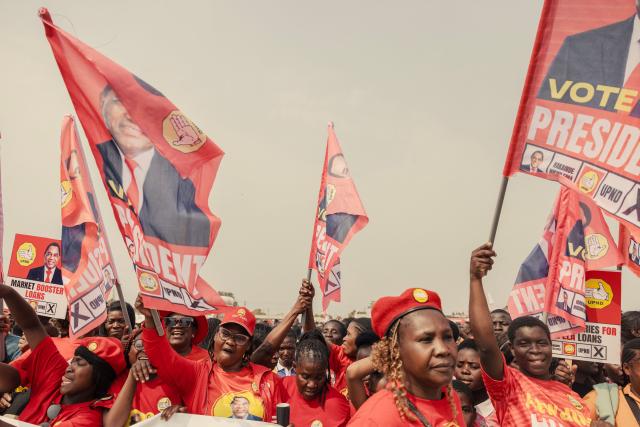 Supporters of Zambian incumbent President and United Party for National Development (UPND) presidential candidate Hakainde Hichilema wave party flags as they attend an election campaign rally in Lusaka on August 11, 2026. Tens of thousands of supporters of Zambian President Hakainde Hichilema thronged the capital Lusaka Tuesday as he made a last-ditch effort to sway undecided voters two days before the election. Hichilema, who came to power in 2021 after defeating the then-ruling Patriotic Front (PF), is seeking another five-year term in the copper-rich country of 22 million people that wants to position itself as a key player in the global green-energy transition. (Photo by GIANLUIGI GUERCIA / AFP)