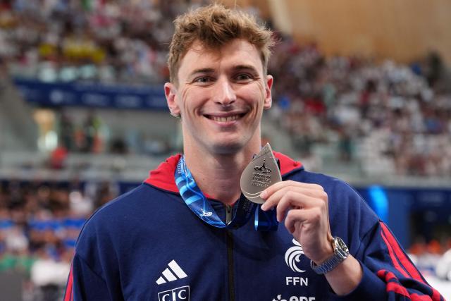 France's Maxime Grousset poses with his silver medal following the podium of the men's 50m butterfly swimming event during the LEN European Aquatics Championships at the Olympic Aquatic Centre in Saint-Denis, northern suburbs of Paris, on August 11, 2026. (Photo by Dimitar DILKOFF / AFP)