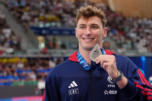 France's Maxime Grousset poses with his silver medal following the podium of the men's 50m butterfly swimming event during the LEN European Aquatics Championships at the Olympic Aquatic Centre in Saint-Denis, northern suburbs of Paris, on August 11, 2026. (Photo by Dimitar DILKOFF / AFP)