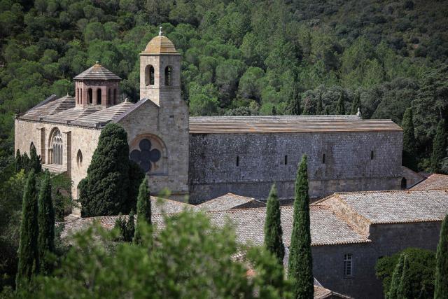 This photograph shows a view of the Cistercian Fontfroide Abbey, near Narbonne, on August 11, 2026. (Photo by Valentine CHAPUIS / AFP)