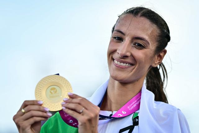 Gold medallist Italy's Nadia Battocletti celebrates with the medal after winning the women's 5000m final during the European Athletics Championships at Alexander Stadium in Birmingham on August 11, 2026. (Photo by Ben STANSALL / AFP)