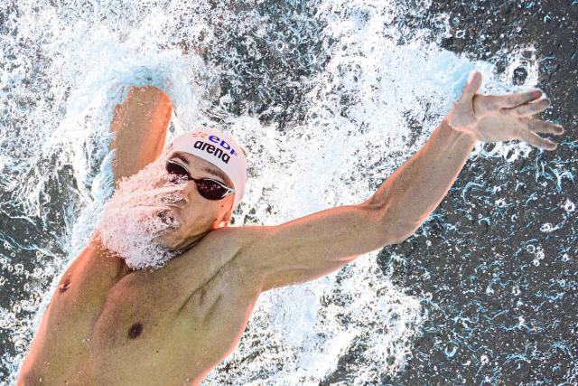 Romania's swimmer David Popovici competes during a semi-final of the men's 100m freestyle swimming event during the LEN European Aquatics Championships at the Olympic Aquatic Centre in Saint-Denis, northern suburbs of Paris, on August 11, 2026. (Photo by Sébastien BOZON / AFP)