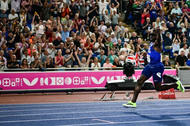 Britain's Romell Glave celebrates as he crosses the finish line to win the men's 100m final during the European Athletics Championships at Alexander Stadium in Birmingham on August 11, 2026. (Photo by Ben STANSALL / AFP)