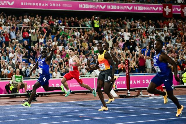 Britain's Romell Glave celebrates as he crosses the finish line to win the men's 100m final during the European Athletics Championships at Alexander Stadium in Birmingham on August 11, 2026. (Photo by Ben STANSALL / AFP)