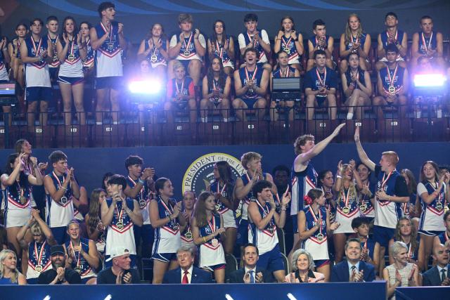 Participants cheer as US President Donald Trump attends the 2026 Patriot Games finals at Spire Academy in Geneva, Ohio on August 11, 2026. (Photo by Jim WATSON / AFP)