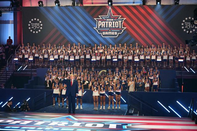 US President Donald Trump salutes before the 2026 Patriot Games finals at Spire Academy in Geneva, Ohio on August 11, 2026. (Photo by Jim WATSON / AFP)