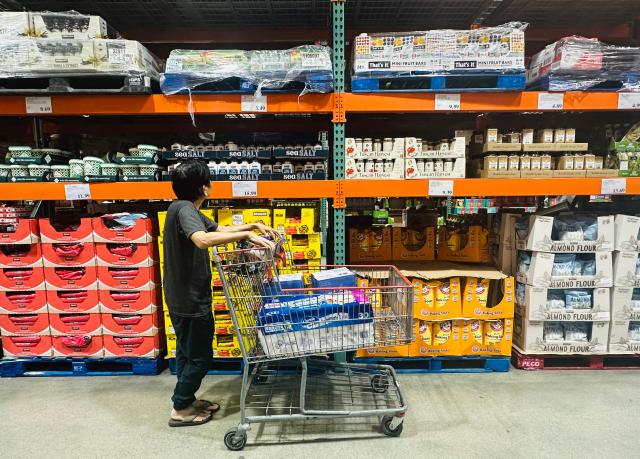 A shopper browses an aisle of food items from a wholesale retailer in Alhambra, California on August 11, 2026. Stock markets mostly rose on August 10 as investors pared their bets on an interest rate hike by the Federal Reserve that curtail growth, awaiting inflation data this week for more clues to the outlook for the world's biggest economy. (Photo by Frederic J. BROWN / AFP)