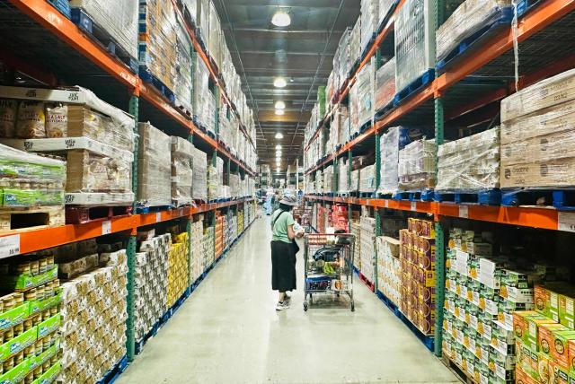 A woman shops for food items from a wholesale retailer in Alhambra, California on August 11, 2026. Stock markets mostly rose on August 10 as investors pared their bets on an interest rate hike by the Federal Reserve that curtail growth, awaiting inflation data this week for more clues to the outlook for the world's biggest economy. (Photo by Frederic J. BROWN / AFP)