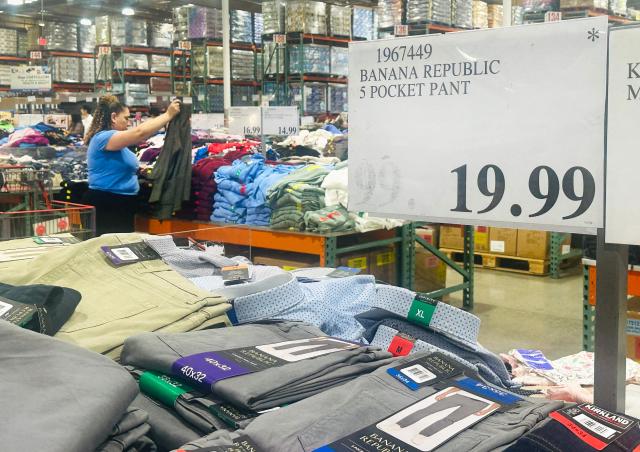 A woman shops for clothing at a wholesale retailer in Alhambra, California on August 11, 2026. Stock markets mostly rose on August 10 as investors pared their bets on an interest rate hike by the Federal Reserve that curtail growth, awaiting inflation data this week for more clues to the outlook for the world's biggest economy. (Photo by Frederic J. BROWN / AFP)