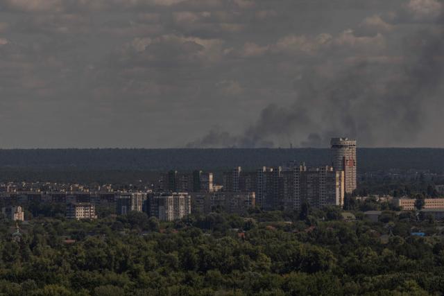 This photograph shows smoke rising in the distance following a Russian air attack, in Kyiv on August 12, 2026, amid the Russian invasion of Ukraine. (Photo by Roman PILIPEY / AFP)