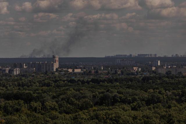 This photograph shows smoke rising in the distance following a Russian air attack, in Kyiv on August 12, 2026, amid the Russian invasion of Ukraine. (Photo by Roman PILIPEY / AFP)
