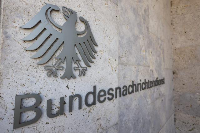 (FILES) The Federal Eagle is seen on the facade of the headquarters of the Federal Intelligence Service BND (Bundesnachrichtendienst) on the day of the handover of the office, in Berlin, Germany, September 11, 2025. The German government on August 12, 2026 signed off on a major overhaul of the country's intelligence agencies to give them broad new powers to conduct covert operations and take action against foreign threats. (Photo by Liesa Johannssen / POOL / AFP)