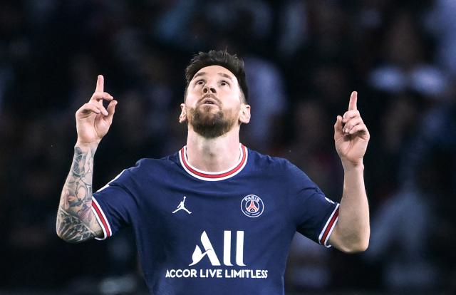(FILES) Paris Saint-Germain's Argentinian forward Lionel Messi (C) celebrates scoring his team's third goal during the UEFA Champions League first round group A football match between Paris Saint-Germain's (PSG) and RB Leipzig, at The Parc des Princes stadium, in Paris, on October 19, 2021. Argentina superstar Lionel Messi said on August 12, 2026 he has "serious doubts" about continuing to play football for "much longer" after the death of his father Jorge Messi. "I don't know what I'll do without you, I don't know how to go on. I just played football, and now I have serious doubts about continuing to do so for much longer," Messi, 39, wrote in a message on social media after his father, who was also his agent, died last week aged 68. (Photo by FRANCK FIFE / AFP)