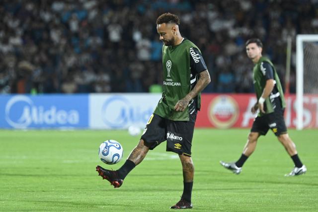 (FILES) Santos' forward #10 Neymar warms up ahead of the Copa Sudamericana group stage football match between Paraguay's Deportivo Recoleta and Brazil's Santos at the Rio Parapiti stadium in Pedro Juan Caballero, Paraguay, on May 5, 2026. Santos will face Ecuador's Macara in the first leg of the Copa Sudamericana round of 16 on August 14, 2026, while Neymar is being linked to Inter Miami, where two former teammates from his time at FC Barcelona play: Lionel Messi and Luis Suarez. Neymar's contract with the Brazilian club expires on December 31, and the 34-year-old forward has given no indication of his future plans. (Photo by Daniel DUARTE / AFP)