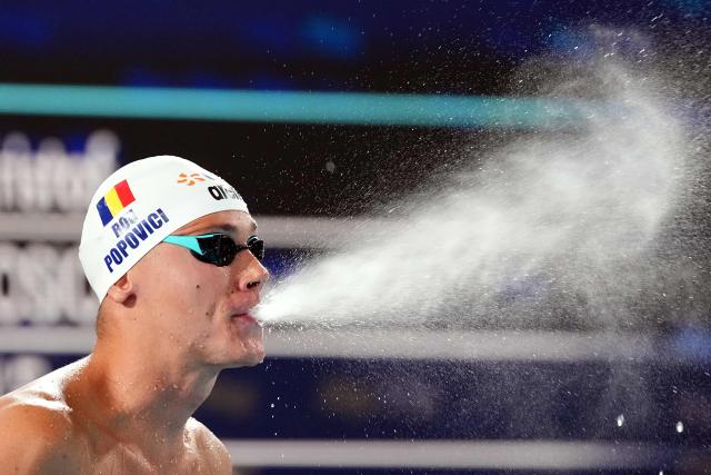 Romania's David Popovici gets ready to compete in the men's 100m freestyle swimming event during the LEN European Aquatics Championships at the Olympic Aquatic Centre in Saint-Denis, northern suburbs of Paris, on August 12, 2026. (Photo by SEBASTIEN BOZON / AFP)