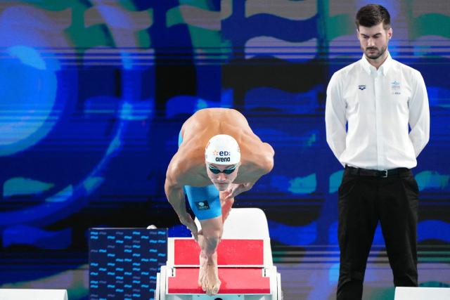 Romania's David Popovici dives as he takes the start of  the final of the men's 100m freestyle swimming event during the LEN European Aquatics Championships at the Olympic Aquatic Centre in Saint-Denis, northern suburbs of Paris, on August 12, 2026. (Photo by Dimitar DILKOFF / AFP)