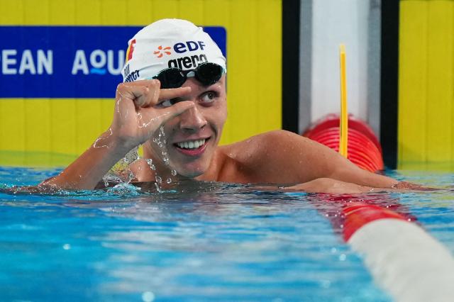 Romania's David Popovici reacts after winning the final of the men's 100m freestyle swimming event during the LEN European Aquatics Championships at the Olympic Aquatic Centre in Saint-Denis, northern suburbs of Paris, on August 12, 2026. (Photo by Dimitar DILKOFF / AFP)
