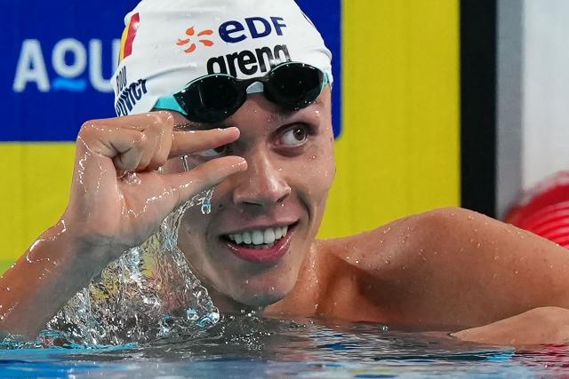 Romania's David Popovici reacts after winning the final of the men's 100m freestyle swimming event during the LEN European Aquatics Championships at the Olympic Aquatic Centre in Saint-Denis, northern suburbs of Paris, on August 12, 2026. (Photo by Dimitar DILKOFF / AFP)