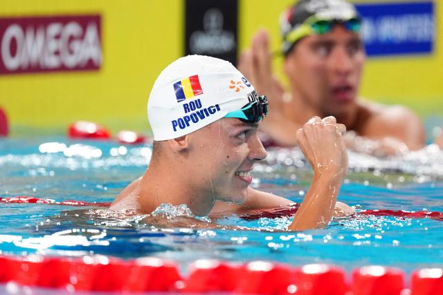 Romania's David Popovici celebrates winning the final of the men's 100m freestyle swimming event during the LEN European Aquatics Championships at the Olympic Aquatic Centre in Saint-Denis, northern suburbs of Paris, on August 12, 2026. (Photo by SEBASTIEN BOZON / AFP)