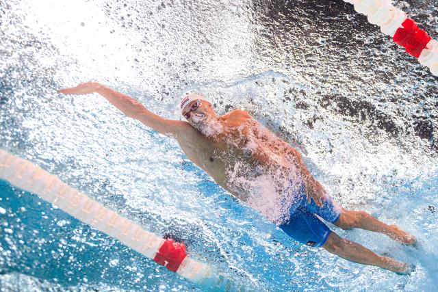 Romania's swimmer David Popovici competes in the final of the men's 100m freestyle swimming event during the LEN European Aquatics Championships at the Olympic Aquatic Centre in Saint-Denis, northern suburbs of Paris, on August 12, 2026. (Photo by Sébastien BOZON / AFP)