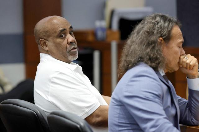 Duane Davis (L) appears in court next to his attorney Michael Sanft during the third day of jury selection in his murder trial, related to the 1996 killing of rapper Tupac Shakur, at Clark County District Court Regional Justice Center in Las Vegas, Nevada, on August 12, 2026. The trial of the former gang leader accused of orchestrating the murder of rapper Tupac Shakur finally began on August 10, 30 years after one of America's most high-profile unresolved killings. The proceedings, expected to last a month, will likely not make clear who fired the shots that killed the California hip-hop legend on the night of September 7, 1996, while he was in Las Vegas to see a Mike Tyson boxing match. (Photo by Steve Marcus / POOL / AFP)