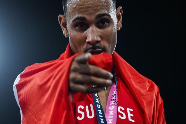 Gold medallist Switzerland's Jason Joseph celebrates after winning in the men's 110m hurdles final during the European Athletics Championships at Alexander Stadium in Birmingham on August 12, 2026. (Photo by Paul ELLIS / AFP)