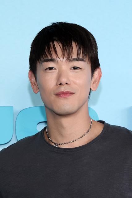 US singer/songwriter Eric Nam, of the upcoming coming-of-age musical drama film "K-Pop: The Debut", attends HYBE America's celebration of K-Pop's biggest weekend at the Grammy Museum in Los Angeles on August 12, 2026. (Photo by VALERIE MACON / AFP)
