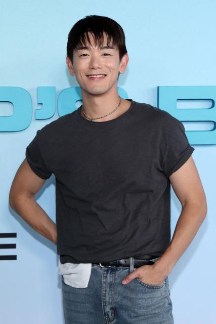 US singer/songwriter Eric Nam, of the upcoming coming-of-age musical drama film "K-Pop: The Debut", attends HYBE America's celebration of K-Pop's biggest weekend at the Grammy Museum in Los Angeles on August 12, 2026. (Photo by VALERIE MACON / AFP)