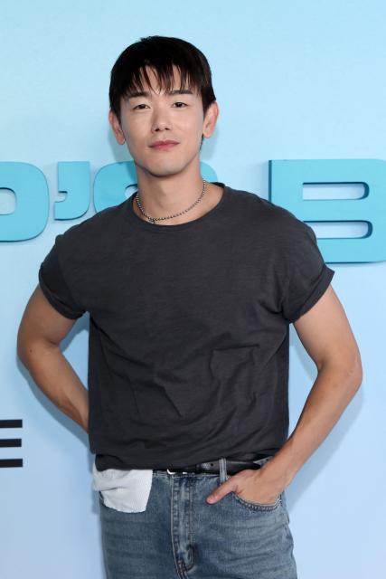 US singer/songwriter Eric Nam, of the upcoming coming-of-age musical drama film "K-Pop: The Debut", attends HYBE America's celebration of K-Pop's biggest weekend at the Grammy Museum in Los Angeles on August 12, 2026. (Photo by VALERIE MACON / AFP)