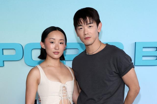 US actress Ji-young Yoo (L) and US singer/songwriter Eric Nam, of the upcoming coming-of-age musical drama film "K-Pop: The Debut", attend HYBE America's celebration of K-Pop's biggest weekend at the Grammy Museum in Los Angeles on August 12, 2026. (Photo by VALERIE MACON / AFP)