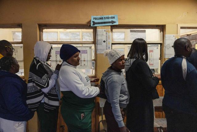 Voters queue to cast their ballots at a polling station in Lusaka on August 13, 2026. Zambians went to the polls on August 13 with economic hardship testing President Hakainde Hichilema's record as he seeks a second term to govern the copper-rich nation. Polling stations in the southern African nation opened at 6:00 am (0400 GMT) and were due to close 12 hours later, with 8.7 million voters registered to cast their ballots. (Photo by GIANLUIGI GUERCIA / AFP)