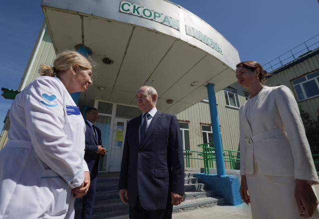 In this pool photograph distributed by the Russian state agency Sputnik, Russia's President Vladimir Putin visits a hospital on Iturup island, one of four islands in the contested chain known as the Kuril Islands in Russia and the Northern Territories in Japan, on August 13, 2026. (Photo by Gavriil Grigorov / POOL / AFP)