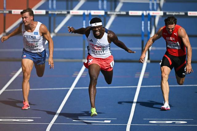 France's Makenson Gletty (C) crosses the finish line to arrive first past third-placed Switzerland's Nino Portmann (R) and fourth-placed Czech Republic's Vilem Strasky (L) in the men's decathlon 110m hurdles heat 3 during the European Athletics Championships at Alexander Stadium in Birmingham on August 13, 2026. (Photo by Paul ELLIS / AFP)