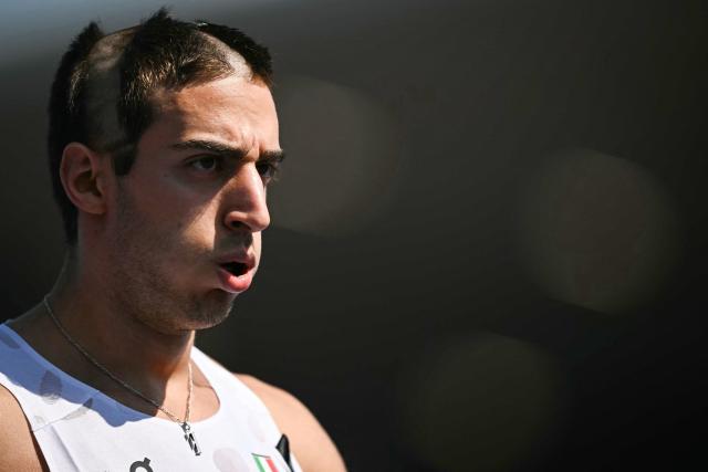First-placed Italy's Filippo Dezza reacts after competing in the men's 200m heats during the European Athletics Championships at Alexander Stadium in Birmingham on August 13, 2026. (Photo by Paul ELLIS / AFP)